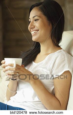 Stock Photo - Woman having cup of coffee. Fotosearch