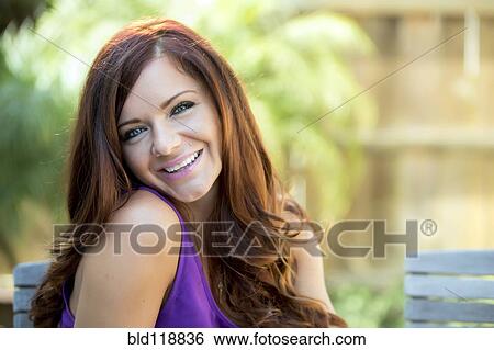 Woman smiling outdoors View Large Photo Image Stock Photograph - Woman smiling outdoors. Fotosearch