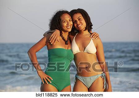 Women smiling together on beach View Large Photo Image Stock Photography - Women smiling together on beach. Fotosearch