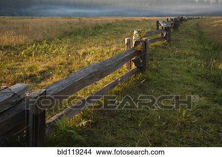 Wooden fence in rural landscape View Large Photo Image Picture - Wooden fence in rural landscape. Fotosearch