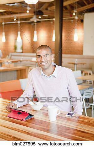 African American businessman using digital tablet in cafe View Large Photo Image Stock Photography - African American businessman using digital tablet in cafe. Fotosearch