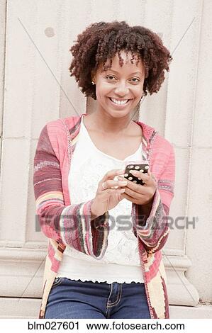 African American woman using cell phone View Large Photo Image Stock Image - African American woman using cell phone. Fotosearch
