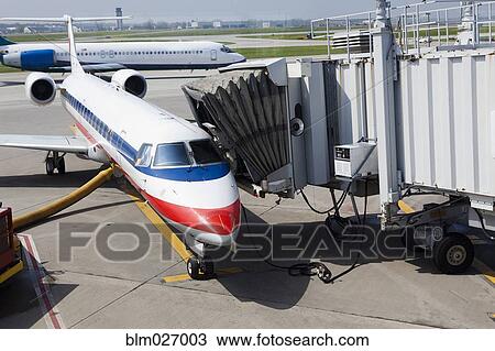 Airplane and boarding apparatus on runway View Large Photo Image Stock Image - Airplane and boarding apparatus on runway. Fotosearch