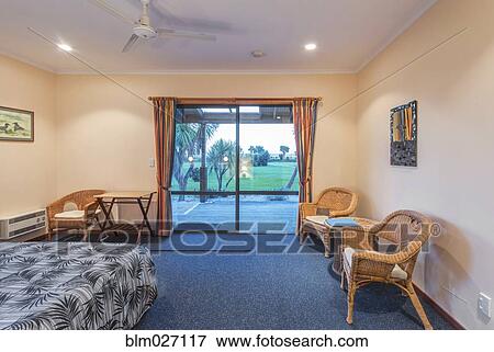 Armchair and bed in hotel room View Large Photo Image Stock Photo - Armchair and bed in hotel room. Fotosearch