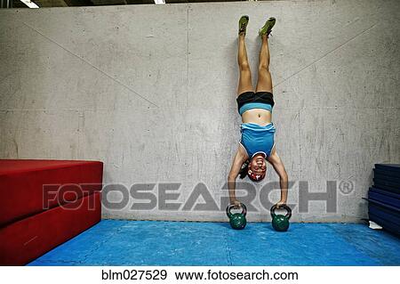 Asian woman exercising in gym View Large Photo Image Stock Photo - Asian woman exercising in gym. Fotosearch