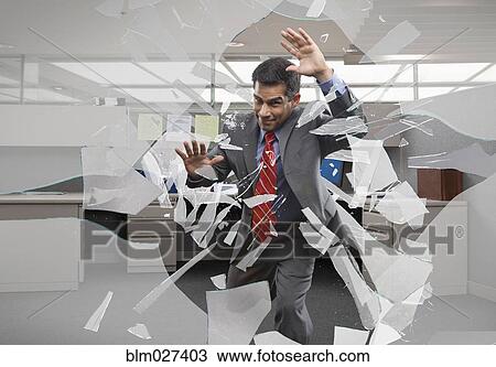 Businessman crashing through office window View Large Photo Image Stock Image - Businessman crashing through office window. Fotosearch