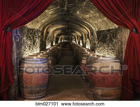 Candles on wine barrels in cave cellar View Large Photo Image Stock Image - Candles on wine barrels in cave cellar. Fotosearch