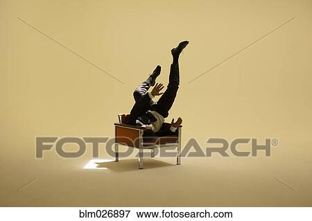 Caucasian businessman sitting under spotlight View Large Photo Image Stock Photo - Caucasian businessman sitting under spotlight. Fotosearch