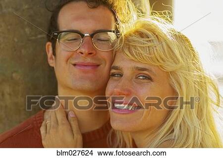 Picture - Caucasian couple smiling outdoors. Fotosearch