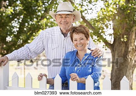 Caucasian couple smiling outdoors View Large Photo Image Stock Image - Caucasian couple smiling outdoors. Fotosearch