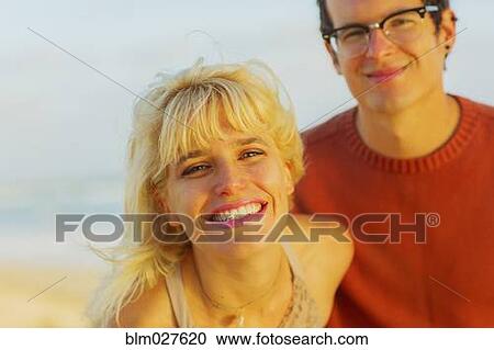Stock Image - Caucasian couple smiling outdoors. Fotosearch