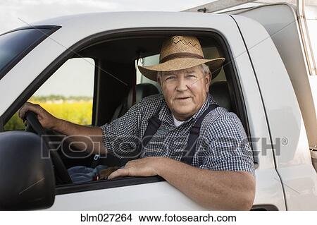 Caucasian farmer driving truck View Large Photo Image Picture - Caucasian farmer driving truck. Fotosearch