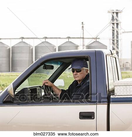 Caucasian farmer driving truck View Large Photo Image Stock Photography - Caucasian farmer driving truck. Fotosearch