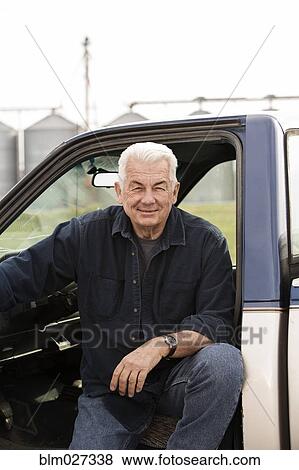 Caucasian farmer in truck View Large Photo Image Stock Photo - Caucasian farmer in truck. Fotosearch
