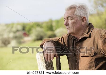 Caucasian man standing outdoors View Large Photo Image Stock Image - Caucasian man standing outdoors. Fotosearch