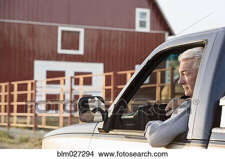 Caucasian rancher driving truck View Large Photo Image Picture - Caucasian rancher driving truck. Fotosearch