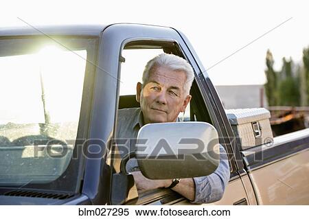 Caucasian rancher driving truck View Large Photo Image Stock Photography - Caucasian rancher driving truck. Fotosearch