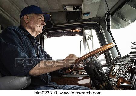 Caucasian trucker driving semi-truck View Large Photo Image Stock Image - Caucasian trucker driving semi-truck. Fotosearch