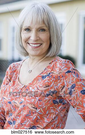 Stock Photograph - Caucasian woman smiling outdoors. Fotosearch