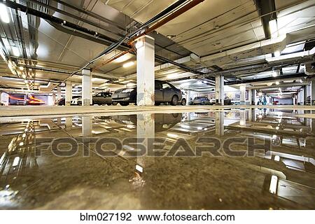 Ceiling reflected in wet parking structure floor View Large Photo Image Stock Image - Ceiling reflected in wet parking structure floor. Fotosearch