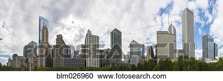 Stock Image - Chicago skyline overlooking urban park, Chicago, Illinois, United States. Fotosearch
