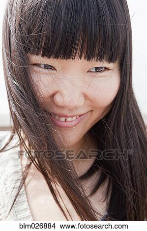 Chinese woman smiling View Large Photo Image Picture - Chinese woman smiling. Fotosearch
