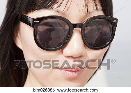 Chinese woman wearing sunglasses View Large Photo Image Stock Photography - Chinese woman wearing sunglasses. Fotosearch