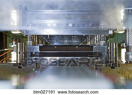 Close up of stamping and pressing machinery View Large Photo Image Stock Image - Close up of stamping and pressing machinery. Fotosearch
