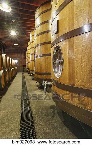 Close up of wine barrels in cellar View Large Photo Image Stock Photo - Close up of wine barrels in cellar. Fotosearch
