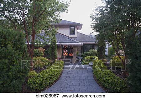 Stock Photo - Cobblestone driveway to house. Fotosearch