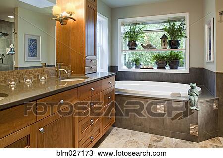 Counter top and bathtub in modern bathroom View Large Photo Image Stock Image - Counter top and bathtub in modern bathroom. Fotosearch