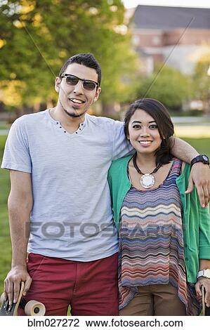 Couple smiling together outdoors View Large Photo Image Stock Image - Couple smiling together outdoors. Fotosearch