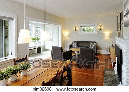 Stock Image - Dining table and livingroom in modern craftsman home. Fotosearch