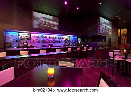 Empty nightclub illuminated with pink and purple light View Large Photo Image Stock Photography - Empty nightclub illuminated with pink and purple light. Fotosearch