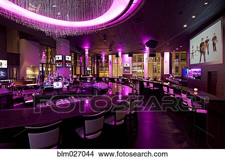 Empty nightclub illuminated with purple neon light View Large Photo Image Picture - Empty nightclub illuminated with purple neon light. Fotosearch