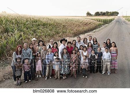 Family smiling together on rural road View Large Photo Image Stock Photo - Family smiling together on rural road. Fotosearch