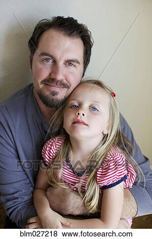 Stock Photo - Father and daughter smiling. Fotosearch