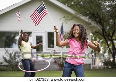 Girls hula hooping with American flags View Large Photo Image Stock Image - Girls hula hooping with American flags. Fotosearch