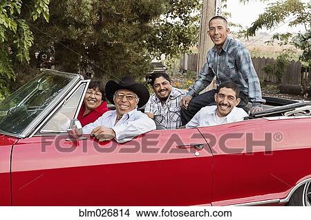 Hispanic family smiling in convertible View Large Photo Image Picture - Hispanic family smiling in convertible. Fotosearch