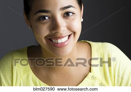 Stock Image - Hispanic woman smiling. Fotosearch
