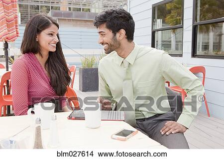 Indian business people talking in cafe View Large Photo Image Picture - Indian business people talking in cafe. Fotosearch