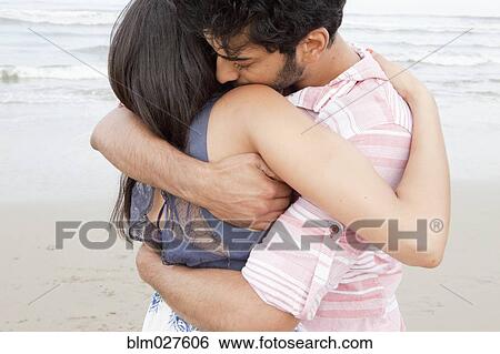 Indian couple hugging on beach View Large Photo Image Stock Photograph - Indian couple hugging on beach. Fotosearch