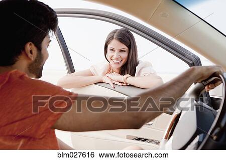 Indian couple talking in car View Large Photo Image Stock Photograph - Indian couple talking in car. Fotosearch
