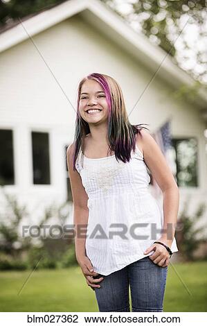Mixed race girl smiling outdoors View Large Photo Image Stock Image - Mixed race girl smiling outdoors. Fotosearch