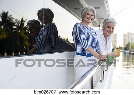 Older Caucasian couple having coffee on boat deck View Large Photo Image Stock Photo - Older Caucasian couple having coffee on boat deck. Fotosearch