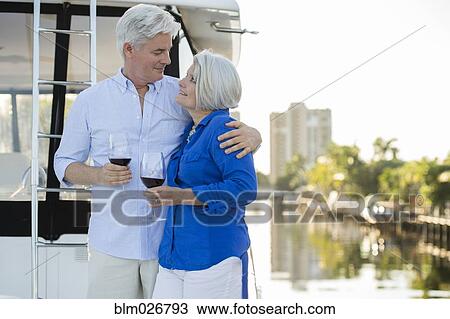 Older Caucasian couple having wine on boat deck View Large Photo Image Stock Image - Older Caucasian couple having wine on boat deck. Fotosearch