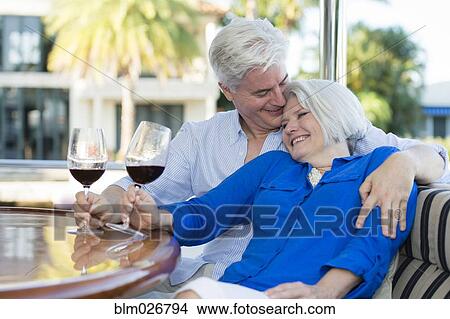 Older Caucasian couple having wine together on boat View Large Photo Image Picture - Older Caucasian couple having wine together on boat. Fotosearch