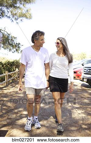 Older Caucasian couple walking outdoors View Large Photo Image Stock Image - Older Caucasian couple walking outdoors. Fotosearch