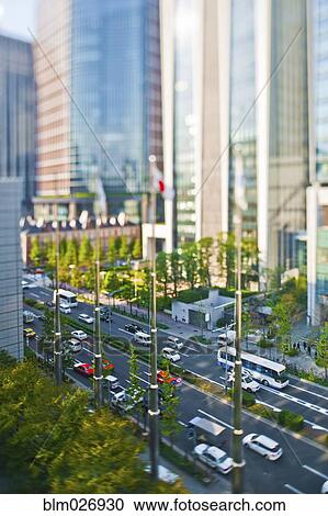 Stock Image - Overhead view of traffic on city street, Tokyo, Japan. Fotosearch