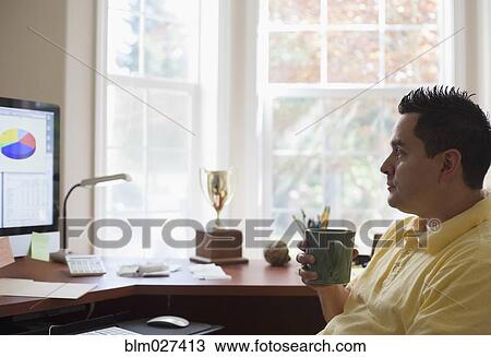 Pacific Islander businessman having coffee at desk View Large Photo Image Stock Image - Pacific Islander businessman having coffee at desk. Fotosearch